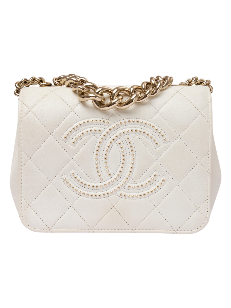 Hera Collective white quilted leather Chanel Beauty Begins flap bag with gold chain strap and studded CC logo