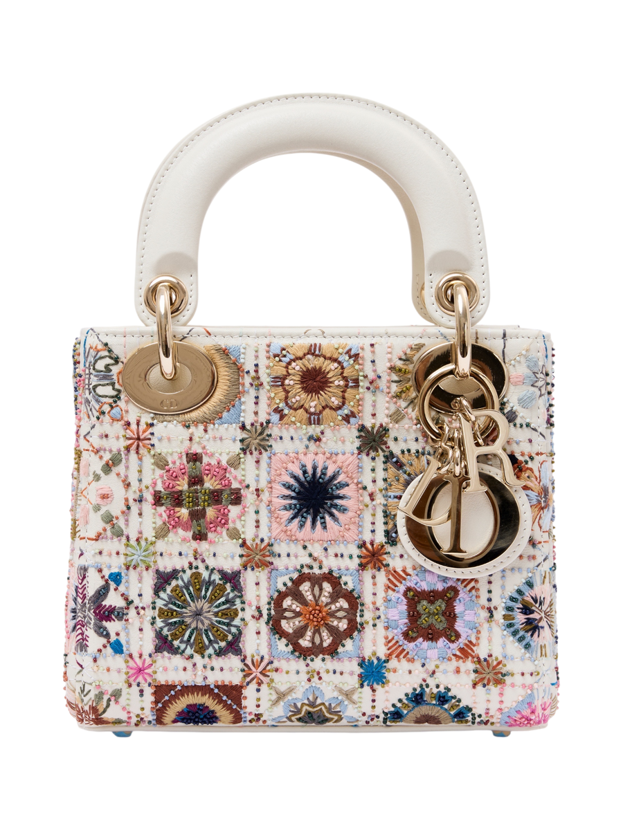 Hera Collective Christian Dior Lady Dior mini bag with intricate multi-colored floral embroidery and gold hardware.