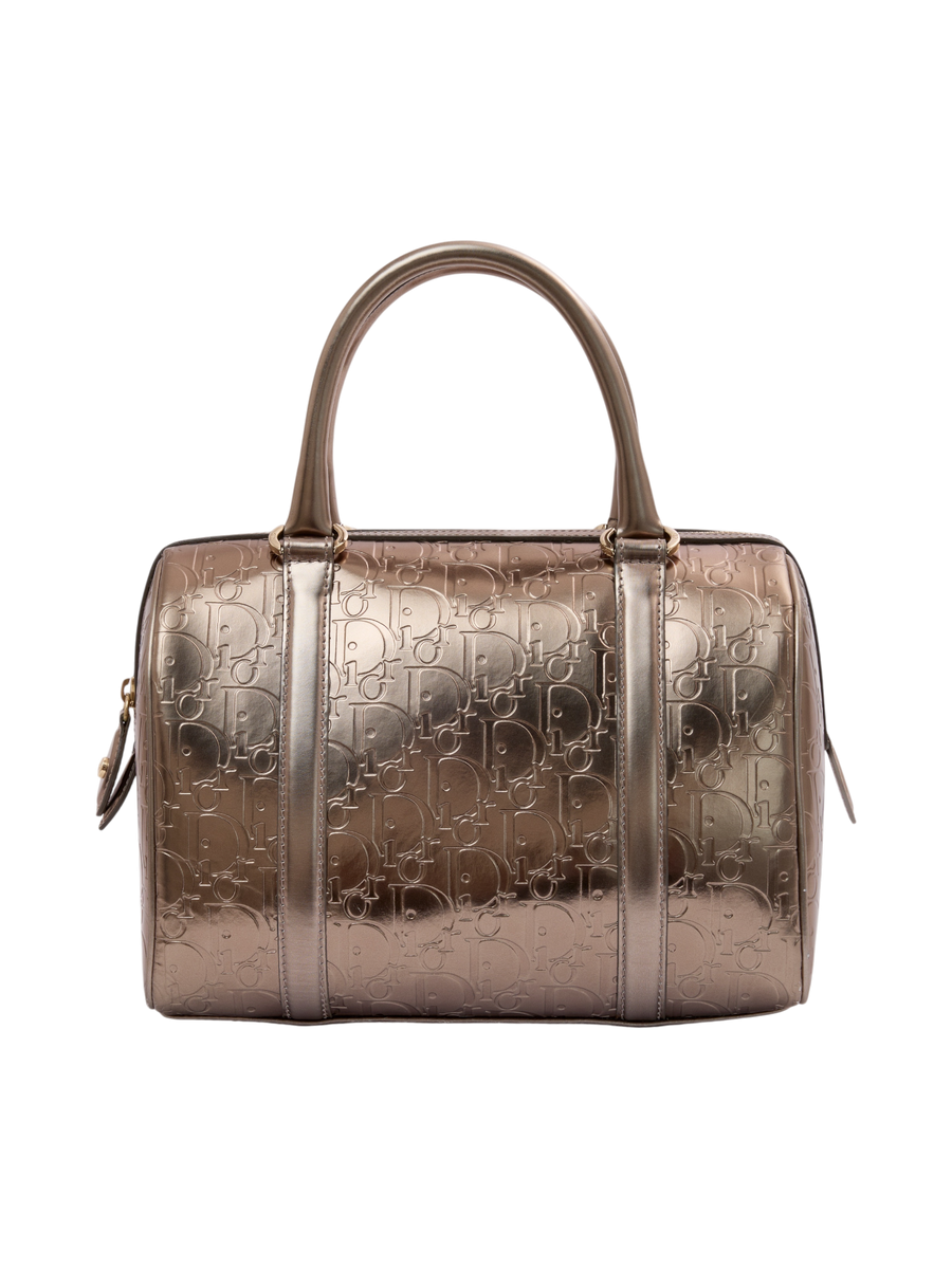 Hera Collective metallic gold Dior Oblique monogram leather Boston bag with rolled handles and zip closure