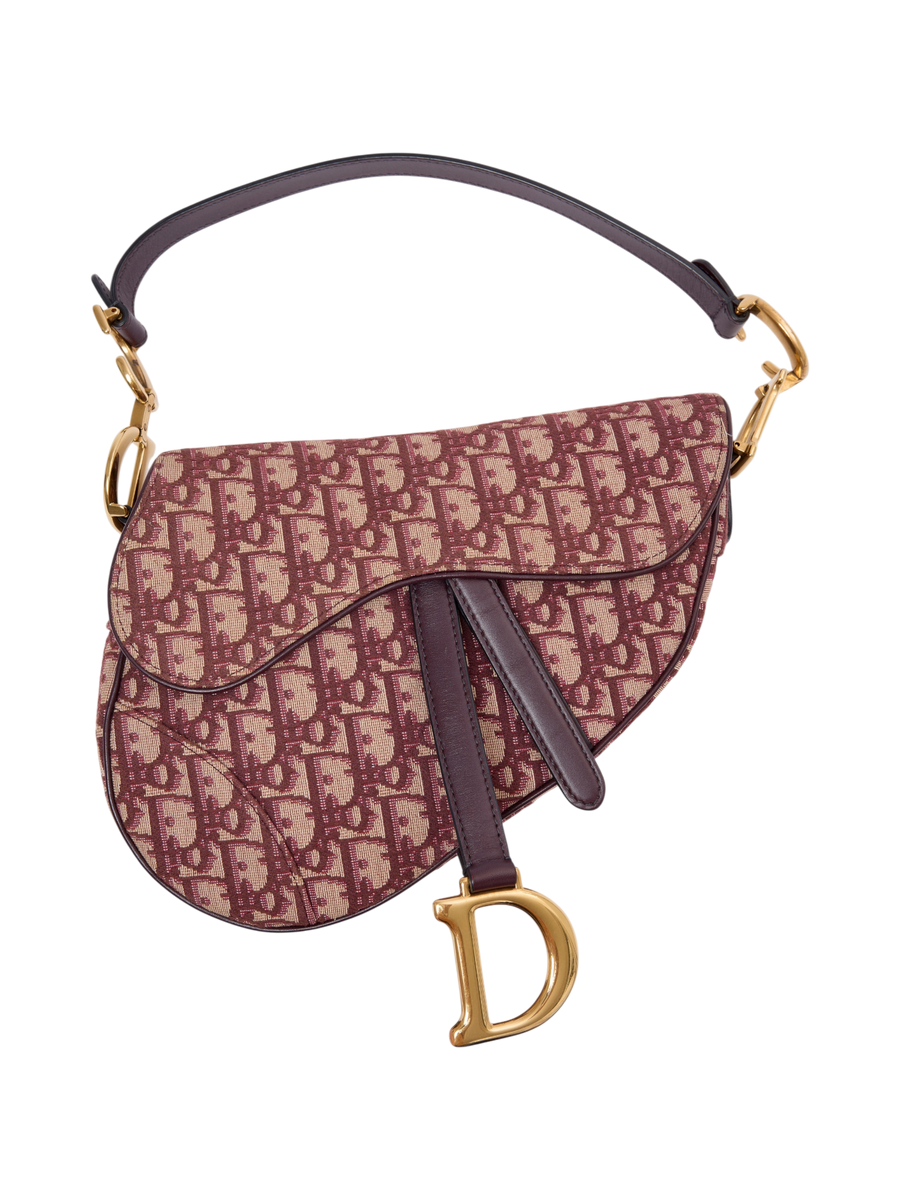 Hera Collective Christian Dior Oblique Saddle Bag in burgundy canvas with gold-tone hardware and leather strap