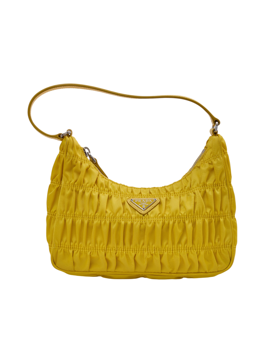 Hera Collective yellow Prada Tessuto Gaufre shoulder bag with gathered nylon pleats and silver triangle logo plaque.